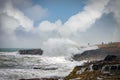 A group of people watching ocean waves Royalty Free Stock Photo