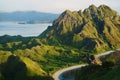A group of people wave Indonesian flag on cliff of padar island, Komodo, Indonesia Royalty Free Stock Photo