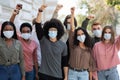 Group of people wearing face mask protesting and giving slogans