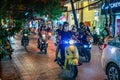 Group of people wearing masks riding cool motorcycles in Hanoi, Vietnam Royalty Free Stock Photo