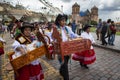 A group of people wearing traditional clothes and masks during the Huaylia on Christmas day