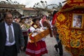 A group of people wearing traditional clothes and masks during the Huaylia on Christmas day at the Plaza de Armas square in the ci