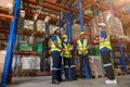 group of people worker in warehouse cargo storage meeting talking together work discussion with foreman manager for planning Royalty Free Stock Photo