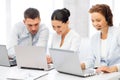 Group of people working with laptops in office Royalty Free Stock Photo