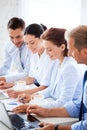 Group of people working with laptops in office Royalty Free Stock Photo