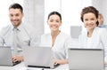 Group of people working with laptops in office Royalty Free Stock Photo