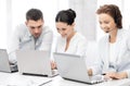 Group of people working with laptops in office Royalty Free Stock Photo