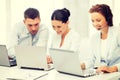 Group of people working with laptops in office Royalty Free Stock Photo