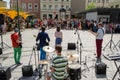 Group perform on street and people listen concert Royalty Free Stock Photo