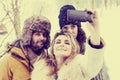 Group of person taking selfie in winter forest Royalty Free Stock Photo