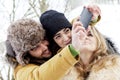 Group of person taking selfie in winter forest Royalty Free Stock Photo