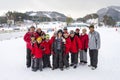 Group photo of 3 generations joyful asian family generations at ski resort.