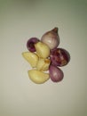 Group photo portrait of shallots and garlic as staple ingredients for cooking in Indonesia Royalty Free Stock Photo