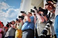 A group of photographers and photojournalists photograph the opening of the theater