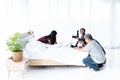 Group of photographers are shooting Asian women in the white bedroom Royalty Free Stock Photo