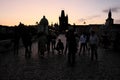 A group of photographers shoots the dawn on the Charles Bridge. Tourists take pictures