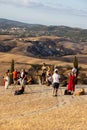 Group of photographers waiting for a golden hour to photograph iconic summer landscape of Toscana. Royalty Free Stock Photo
