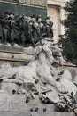 Group of Pigeons on Lion head statue at Piazza Duomo of Milano Italy, dirty from bird pooping shit on attractive sculpture art, tr