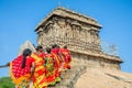 Group of pilgrim women dressed in colorful red and yellow sarees on the way to Olakkannesvara Temple, Mahabalipuram,