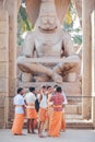 Hindus dressed in orange clothes stands in front of Narasimha Royalty Free Stock Photo