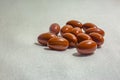 Group of pills on a white background with fabric texture shot in Royalty Free Stock Photo