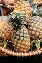 Group of pineapple on the basket in the gourmet market waiting for buyer