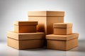 A group of plain brown cardboard storage boxes of various sizes arranged together on a clean neutral background with soft lighting Royalty Free Stock Photo