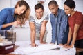 Group, planning and architects with blueprint for discussion, building or construction project in creative startup Royalty Free Stock Photo