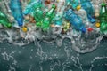 Group of Plastic Bottles Floating on Water Royalty Free Stock Photo