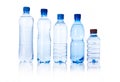 Group plastic bottles of water on white