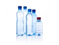 Group plastic bottles of water on white