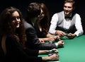 Players sitting at the playing table in the casino Royalty Free Stock Photo