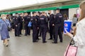 A group of policemen waiting into an underground subway car