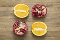 Group pomegranate and orange fruit lay on wooden table