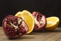 Group pomegranate and orange fruit on wooden table