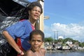 Group portrait of boy with mother in Brazilian slum