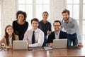Portrait of smiling multiracial colleagues posing at meeting Royalty Free Stock Photo