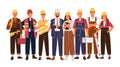 Group portrait of cute happy industry or construction workers, engineers standing together. Team of smiling male and