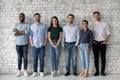 Group portrait of diverse millennial team of employees
