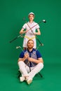 Group portrait of father and daughter on golf court. Dad, man and girl, teenager dressed like golf players posing with Royalty Free Stock Photo