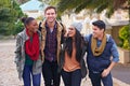 Group, portrait and friends walking to campus, college and university with backpack outdoor. Street, academic people and Royalty Free Stock Photo