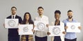 Group portrait of happy diverse business people holding pictures of different gears Royalty Free Stock Photo