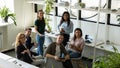 Group portrait of happy diverse business people meeting in office