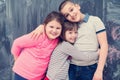 Group of kids hugging in front of chalkboard Royalty Free Stock Photo