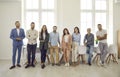 Group portrait of happy successful young and mature business people standing in office Royalty Free Stock Photo