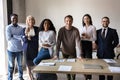 Portrait of smiling diverse employees posing together in office Royalty Free Stock Photo