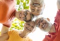 Group portrait of happy senior friends looking down at the camera outdoors Royalty Free Stock Photo