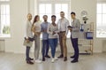 Team of happy successful diverse business people standing in the office and smiling Royalty Free Stock Photo