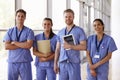 Group portrait of healthcare workers in hospital corridor Royalty Free Stock Photo
