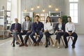 Group portrait of people sitting in row during business meeting or educational lecture